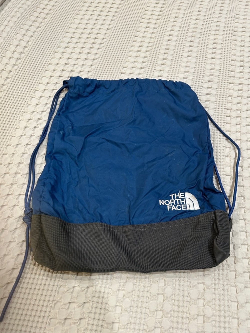 The North Face Blue and Black Drawstring Pack